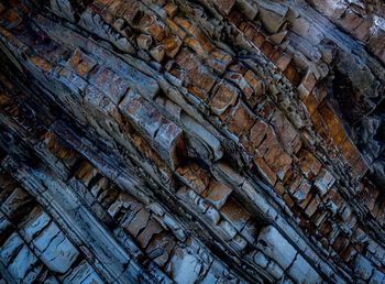 Low angle view of old weathered wall