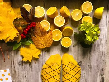 High angle view of yellow flowers on table