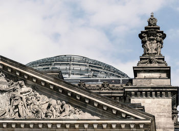 Low angle view of historical building against cloudy sky