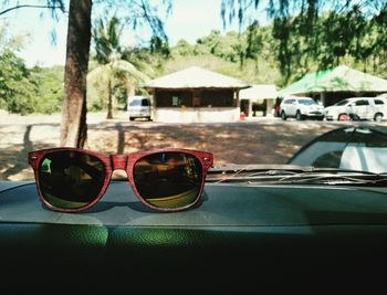 Close-up of sunglasses on road