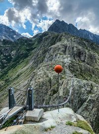 Scenic view of rocks and mountains against sky