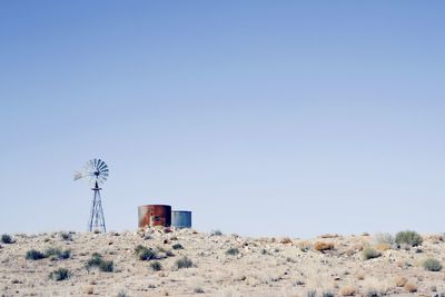 Built structure on land against clear blue sky