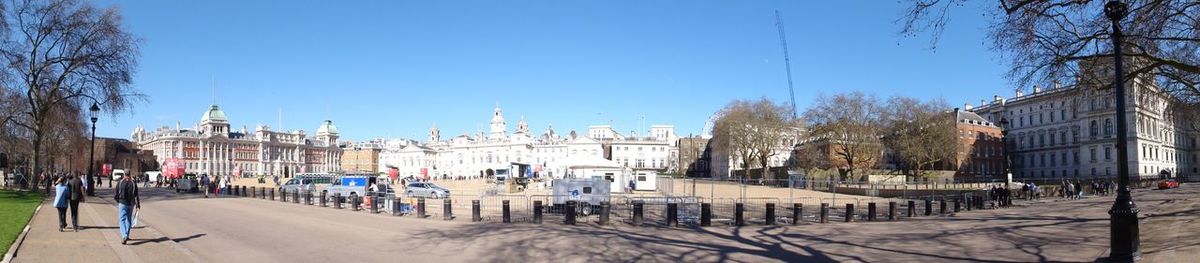 Panoramic view of city against blue sky