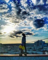 Full length of man standing by sea against sky