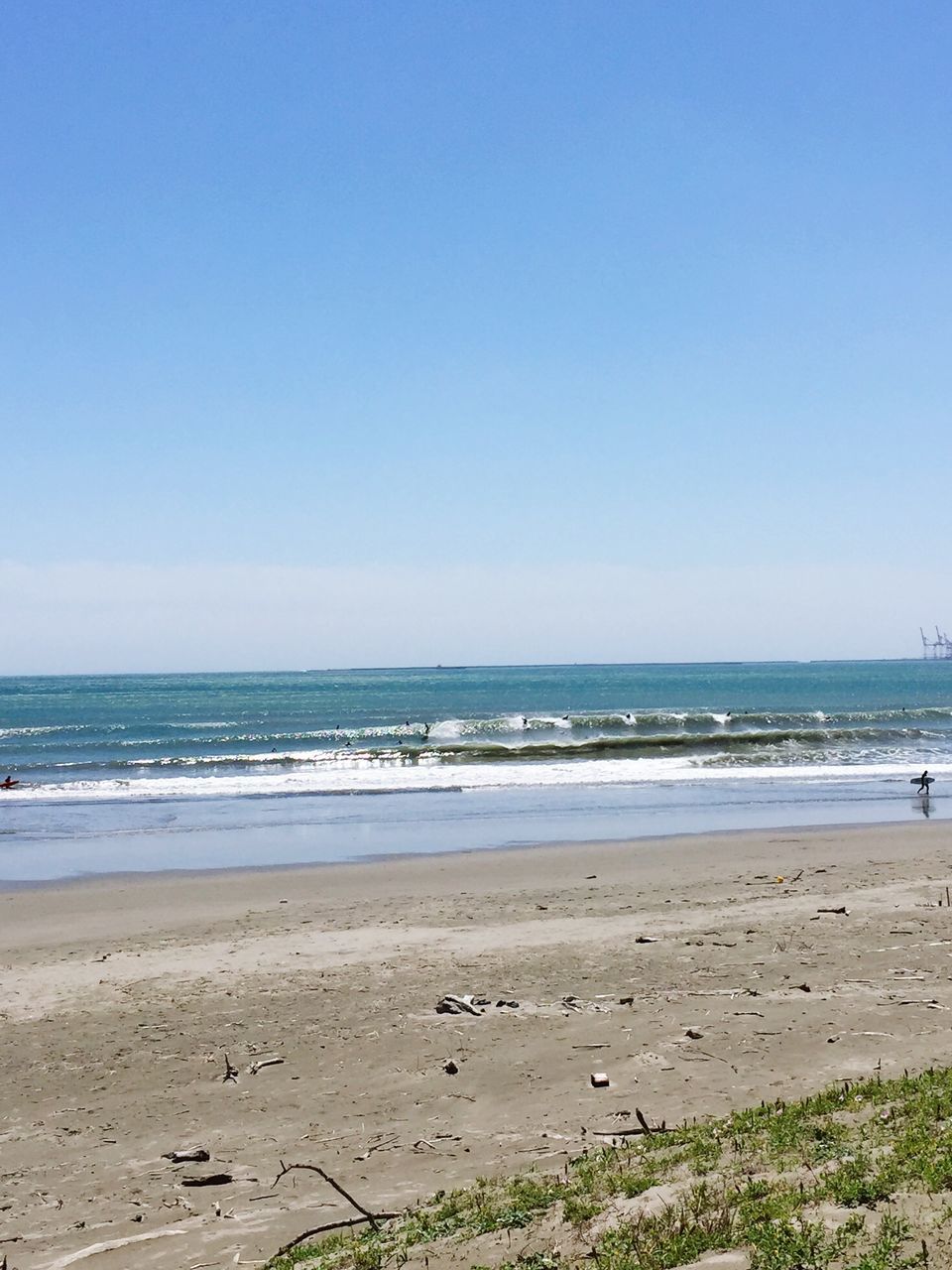 sea, horizon over water, beach, water, clear sky, shore, sand, tranquil scene, copy space, tranquility, scenics, beauty in nature, blue, nature, wave, idyllic, coastline, surf, remote, sky