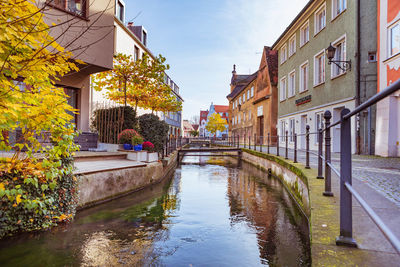 Canal amidst buildings in city