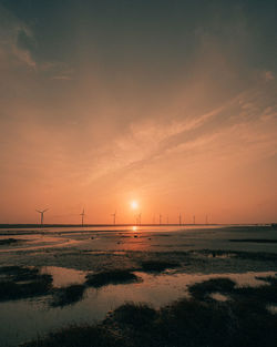 Scenic view of sunset over land