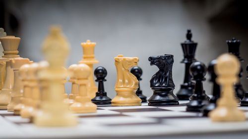 Close-up of chess board on table