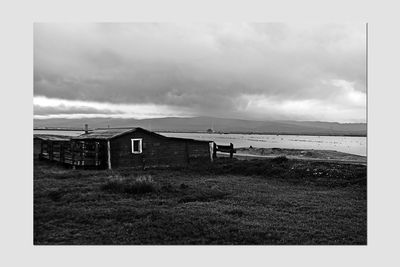 House on field against sky