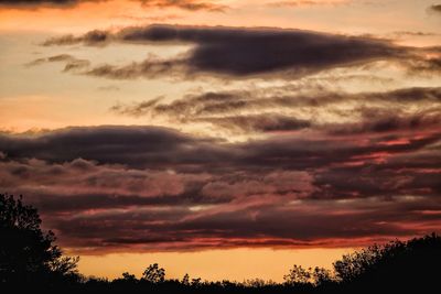 Low angle view of dramatic sky during sunset