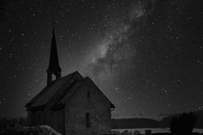 Low angle view of building against sky at night