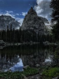 Idyllic shot of lone eagle peak by lake