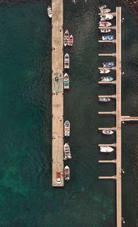 High angle view of information sign on pier over river