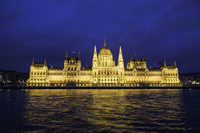 Illuminated buildings at waterfront