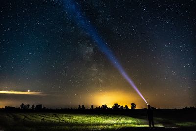 Scenic view of field against sky at night