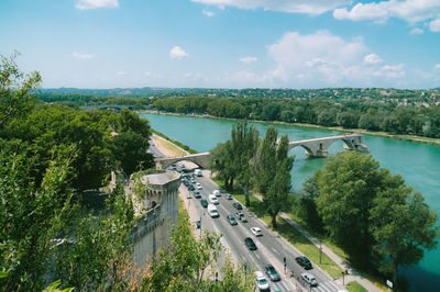 High angle view of river amidst trees against sky