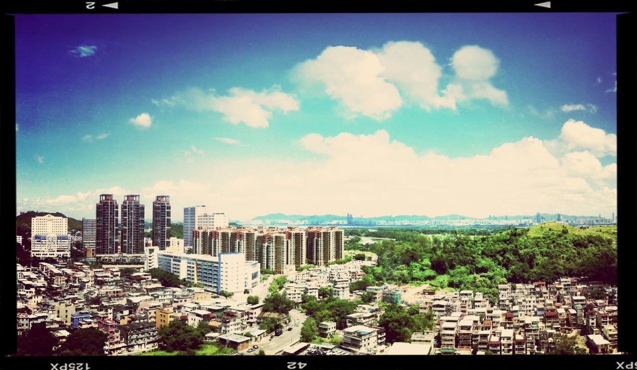 transfer print, auto post production filter, building exterior, architecture, built structure, cityscape, city, sky, cloud - sky, crowded, cloud, residential district, high angle view, residential building, residential structure, tree, panoramic, blue, outdoors, no people