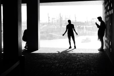 Silhouette woman standing in corridor