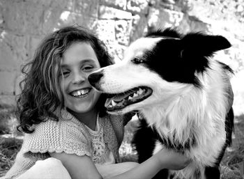 Portrait of cute girl with dog