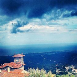 Scenic view of sea against cloudy sky