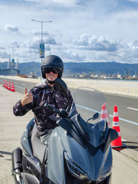 Man riding motorcycle on road