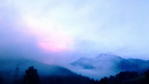 Scenic view of silhouette mountains against sky