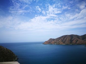 Scenic view of sea against blue sky