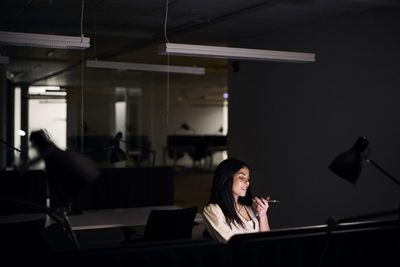 Woman working late in office