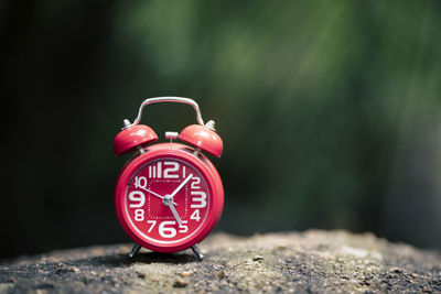 Close-up of clock on rock