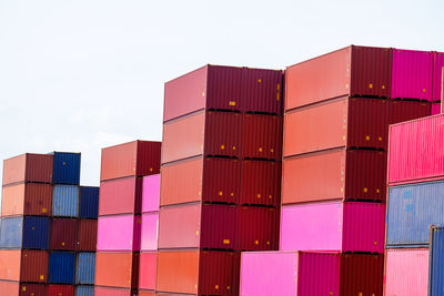 Stack of multi colored building against sky