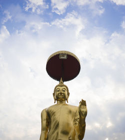 Low angle view of statue against sky