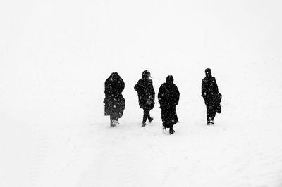 Person standing on snow covered landscape