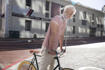 Mature man riding bicycle in the city