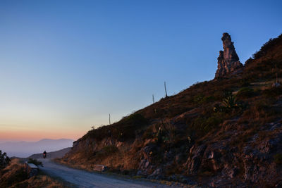 Scenic view of mountains against clear blue sky