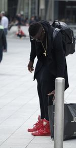 Man with umbrella in city