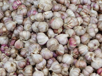 Full frame shot of garlic for sale at market