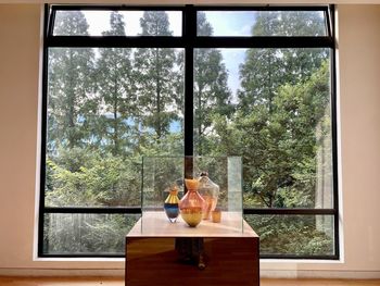 View of wine glass on table against window