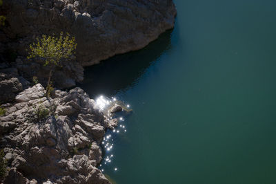 High angle view of rock formation in sea