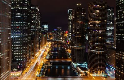 Aerial view of city lit up at night