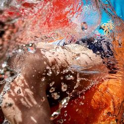 Close-up of woman swimming in water