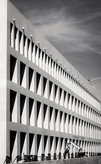 Low angle view of bridge against sky in city