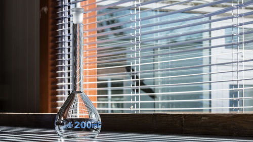 Close-up of glass window on table