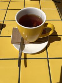 Close-up of coffee cup on table