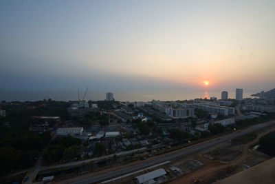 High angle view of buildings against sky during sunset