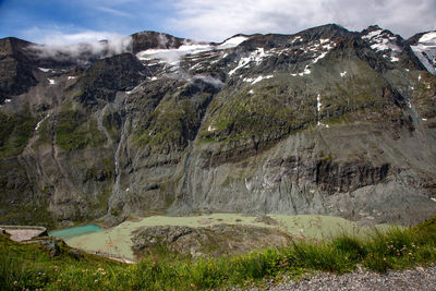 Scenic view of landscape and mountains against sky