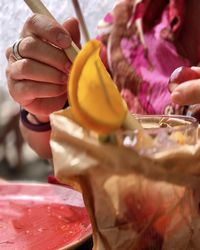 Close-up of hand holding ice cream
