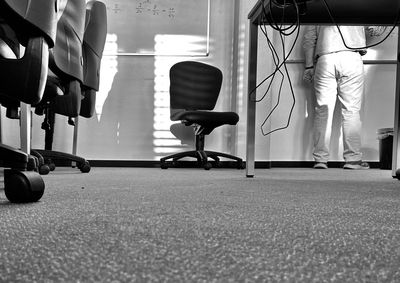Low section of man walking on seat