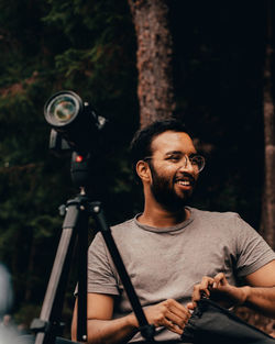 Portrait of young man photographing