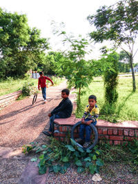 Men sitting in park