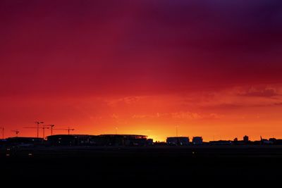 Silhouette road against sky during sunset